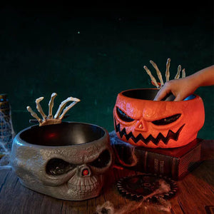 Halloween candy skull bowl with movable skeleton hand